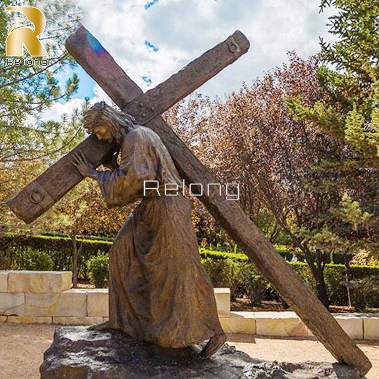 bronze jesus with cross statue