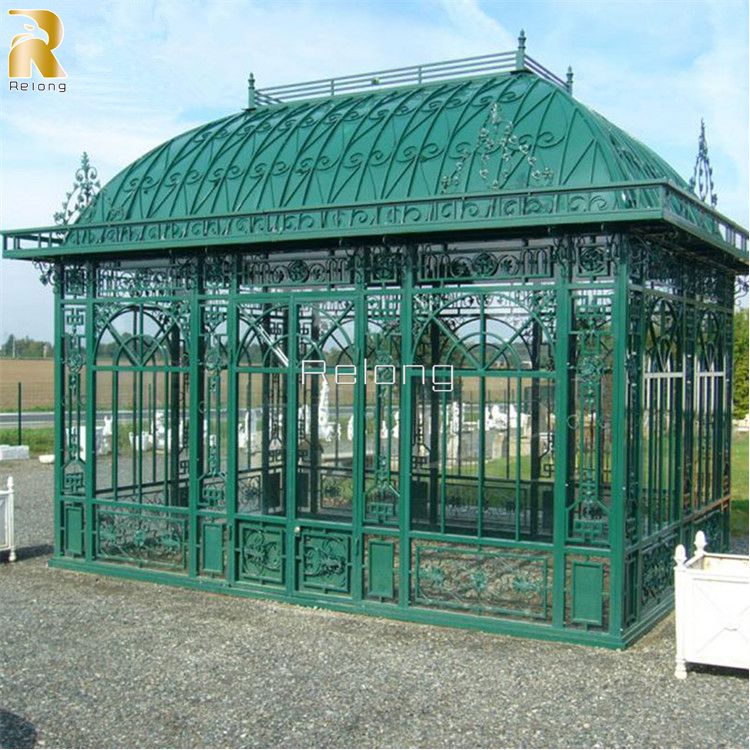 green wrought iron greenhouse