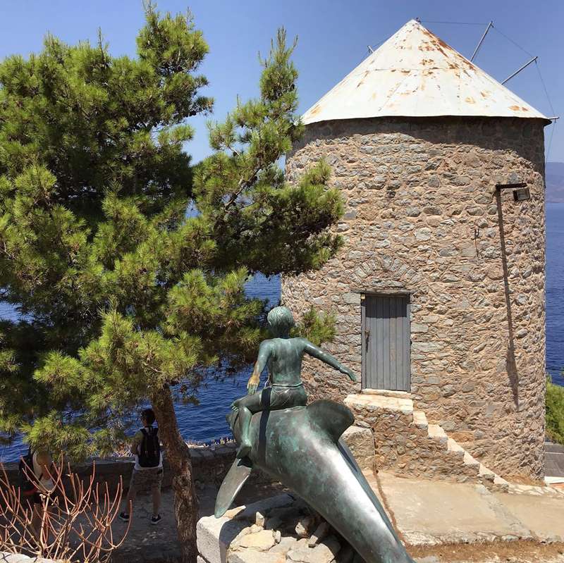 boy on a dolphin statue decor