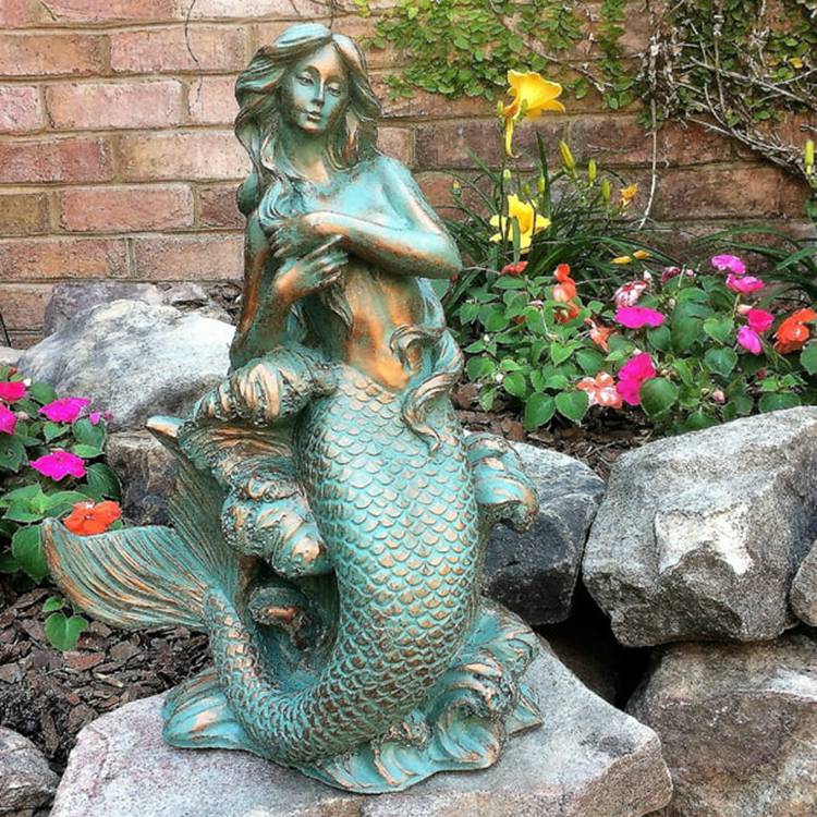 large outdoor mermaid statues