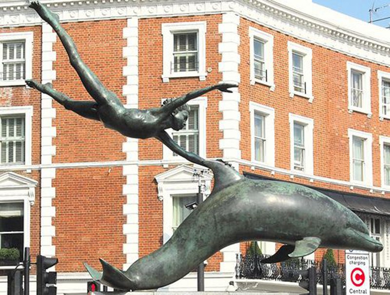 outdoor boy with dolphin statue decoration