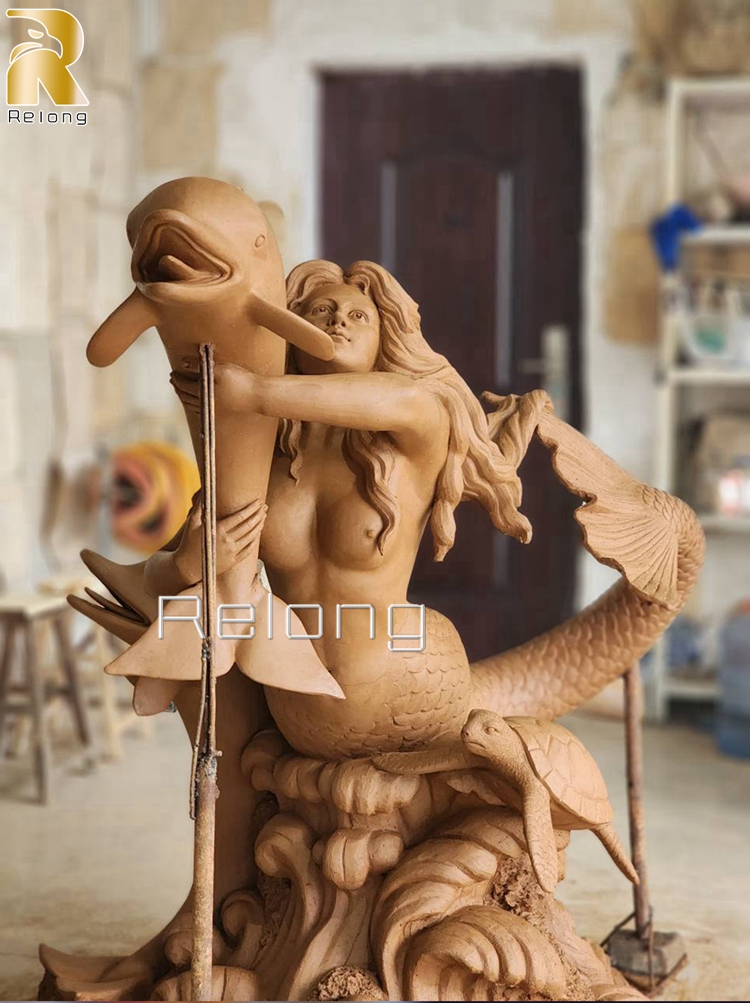 realistic clay model of the mermaid statue