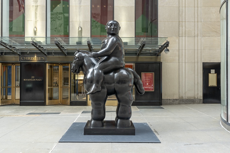 bronze fat horse with woman sculpture