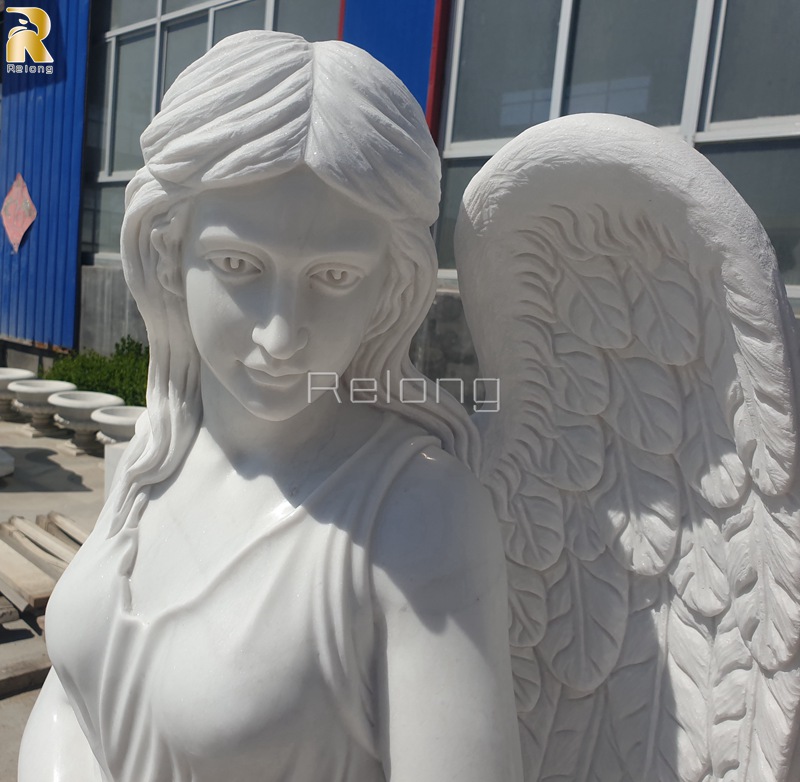 intricate details of white marble tombstone