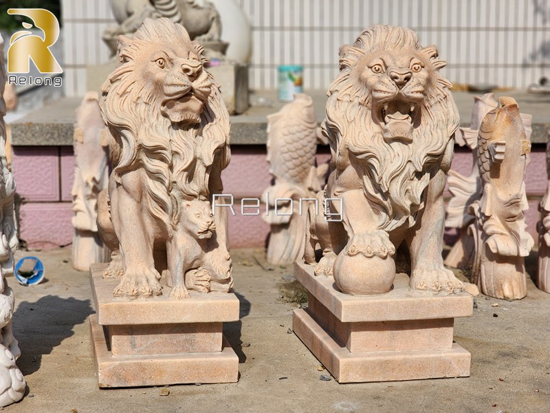 marble lion statue with ball