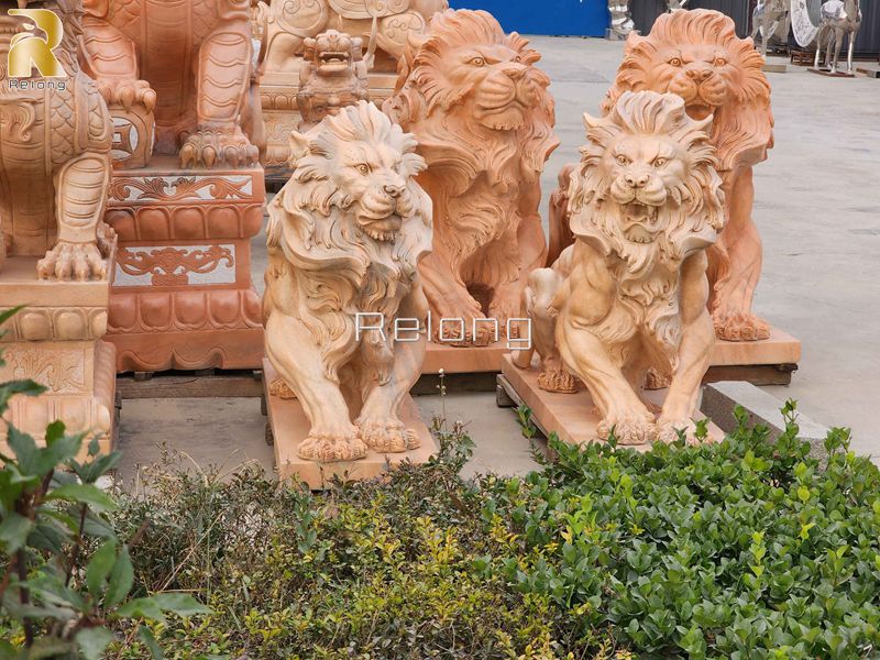 outdoor red marble lion sculpture