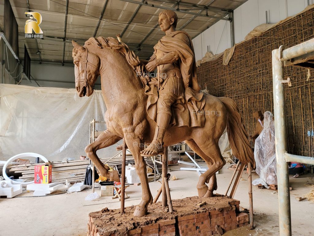 realistic clay model of the man with horse statue