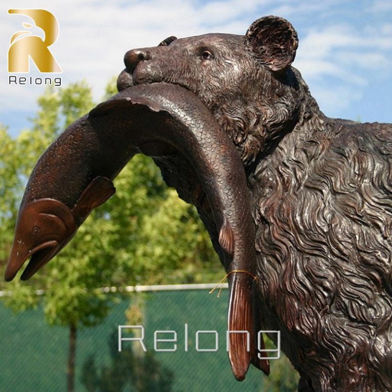 bronze bear with fish in mouth statue