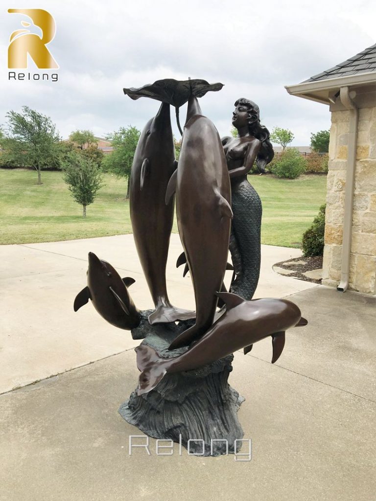 bronze mermaid and dolphin fountain