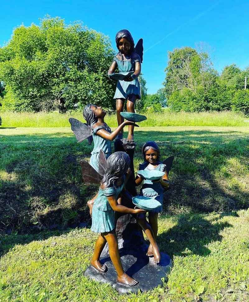 bronze water fountain with children statue