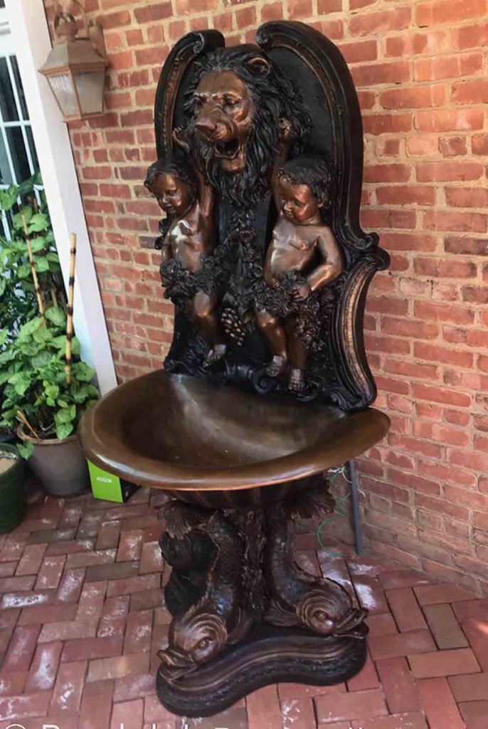 cherub wall fountain with lion head