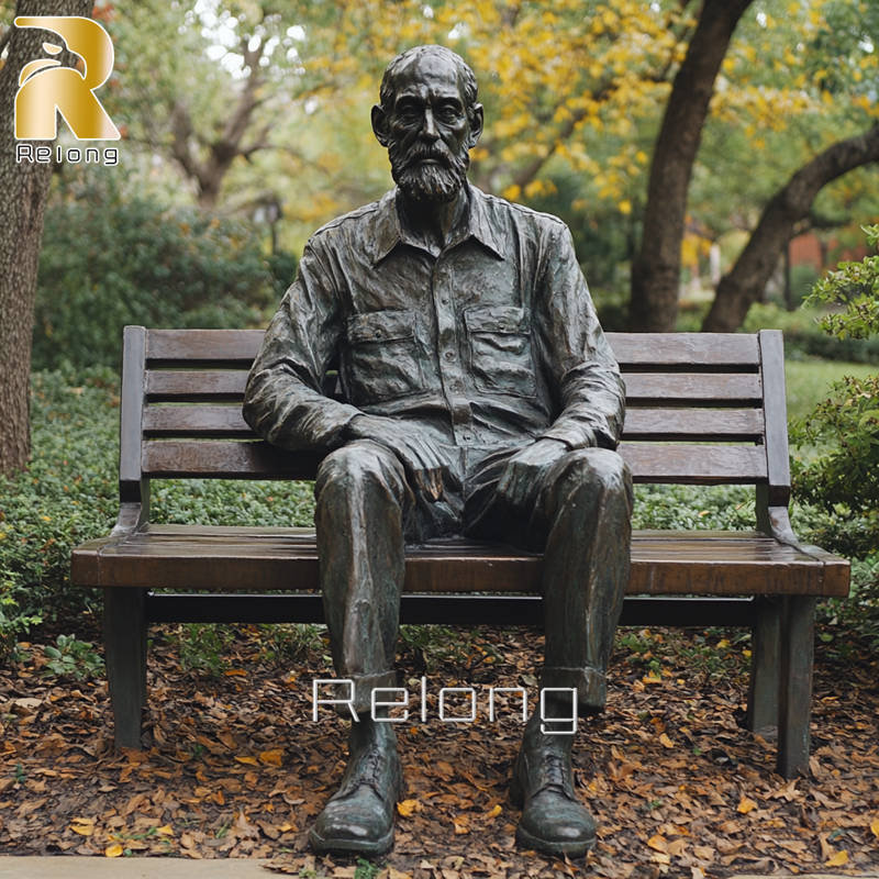 bronze man sitting on bench sculpture