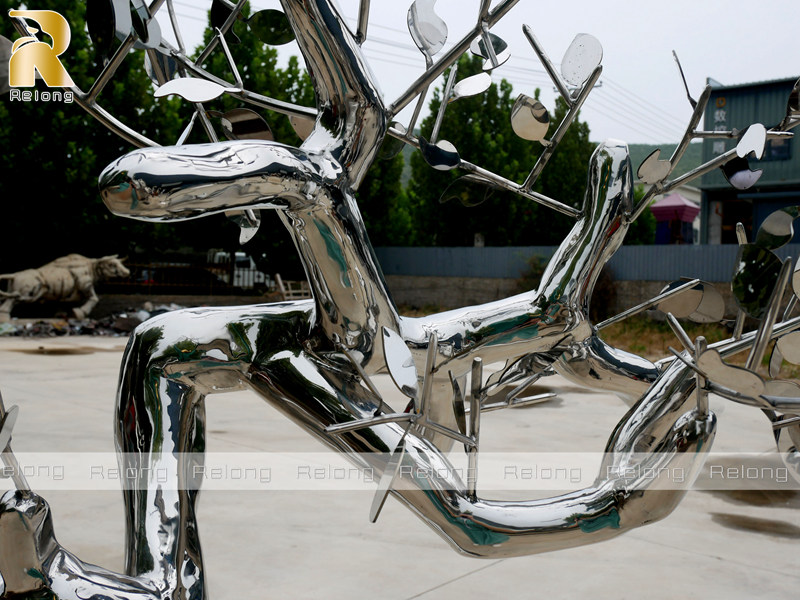 mirror polished metal tree sculpture