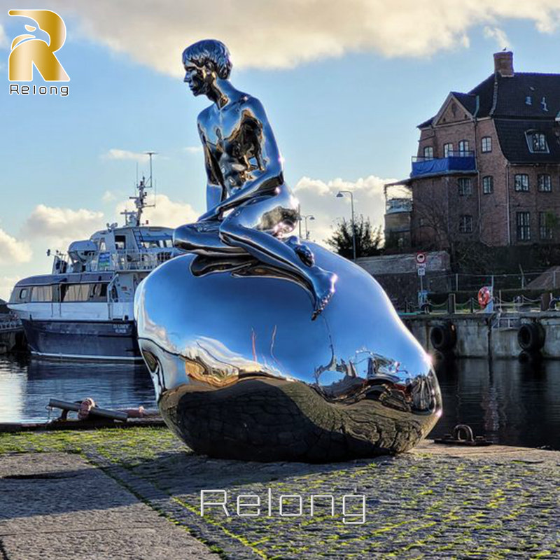 life size stainless steel merman sculpture