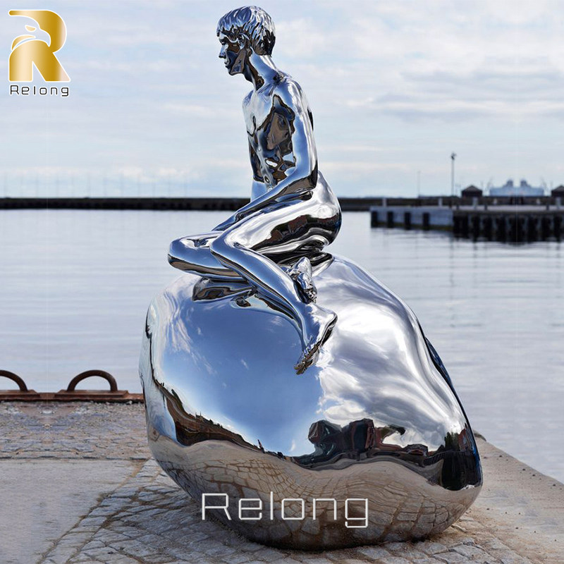 stainless steel merman sculpture