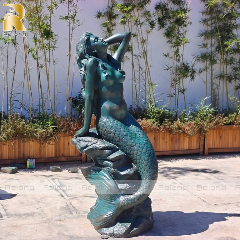 large brass mermaid statue